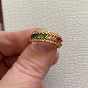 Rainbow gem colored ring in gold. About size 6. Costume piece